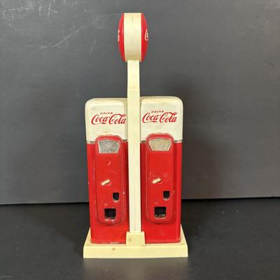 LOT 114: Black & White Framed Photos of Store Fronts, Ande Rooney Metal Sign, Coca-Cola Glasses, 1993 Coca-Cola Vending Machine...