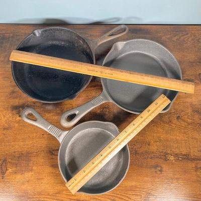 LOT 154: Three Cast Iron Skillets with Collection of Utensils / Gadgets