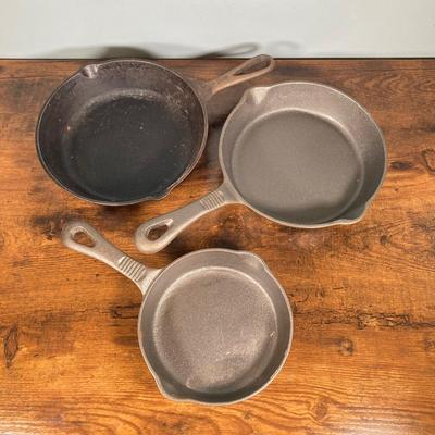 LOT 154: Three Cast Iron Skillets with Collection of Utensils / Gadgets