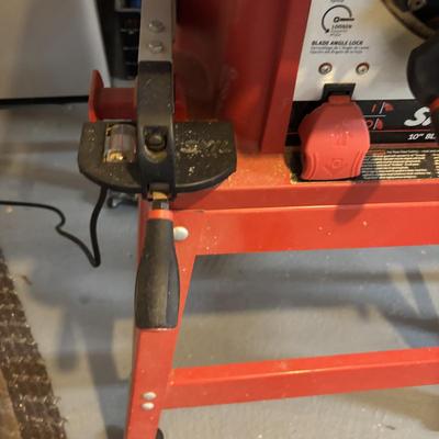 LOT 172: Skil 10-inch Table Saw on Stand & Adjustable Rolling Stand