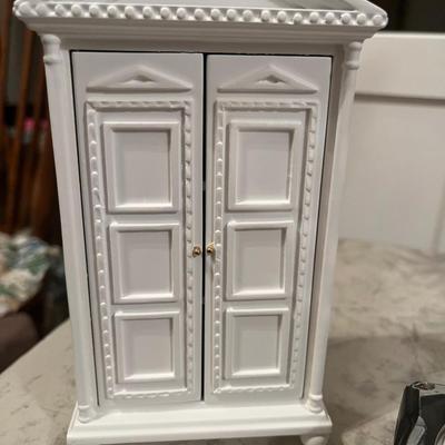 White wooden doll cabinet