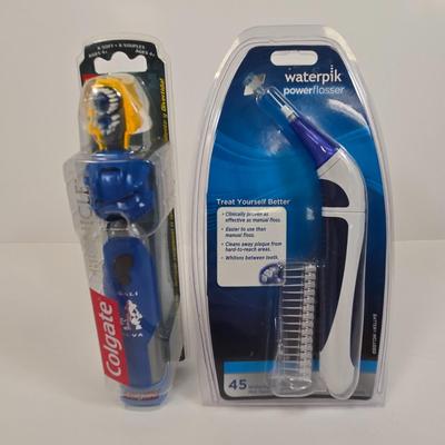 LOT 34: American Heart Association Family & Friends CPR Anytime Training Kit, HoMedics Cordless Percussion Body Massager with...