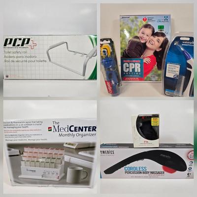 LOT 34: American Heart Association Family & Friends CPR Anytime Training Kit, HoMedics Cordless Percussion Body Massager with...