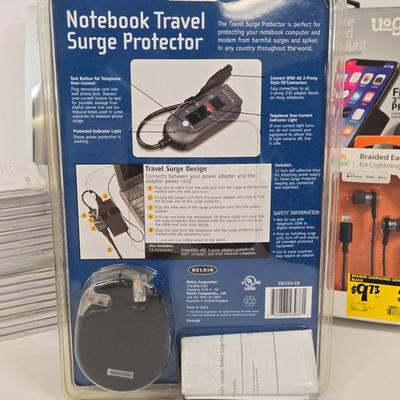 LOT 39: Notebook Travel Surge Protecter, Tech and Go Braided Earphones, Soleus Running Watch, Dashboard Phone Mount, Multiple Screen...