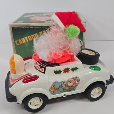 LOT 86: Gemmy Animated Musical Lowrider Car with Santa and Reindeer, Son Ai Santa Claus Cartoon Car Christmas Retro Vintage Toy in Box,...
