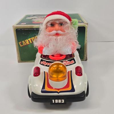LOT 86: Gemmy Animated Musical Lowrider Car with Santa and Reindeer, Son Ai Santa Claus Cartoon Car Christmas Retro Vintage Toy in Box,...