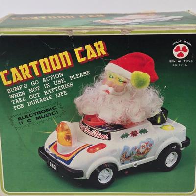 LOT 86: Gemmy Animated Musical Lowrider Car with Santa and Reindeer, Son Ai Santa Claus Cartoon Car Christmas Retro Vintage Toy in Box,...