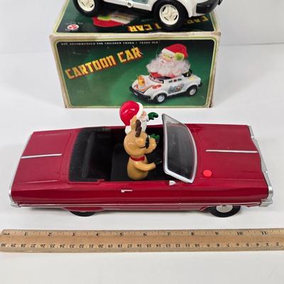 LOT 86: Gemmy Animated Musical Lowrider Car with Santa and Reindeer, Son Ai Santa Claus Cartoon Car Christmas Retro Vintage Toy in Box,...