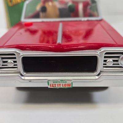 LOT 86: Gemmy Animated Musical Lowrider Car with Santa and Reindeer, Son Ai Santa Claus Cartoon Car Christmas Retro Vintage Toy in Box,...