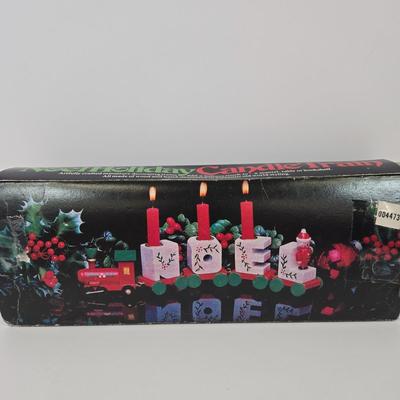 LOT 92: Two Lighted Santa Claus Christmas Window Decor, Two Miniature Noel Candle Trains, and Jolly St Nick Collection Two Jovial Holiday...