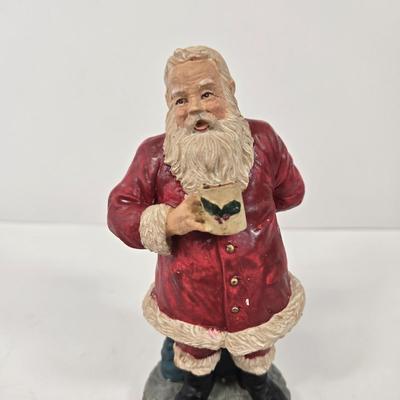 LOT 92: Two Lighted Santa Claus Christmas Window Decor, Two Miniature Noel Candle Trains, and Jolly St Nick Collection Two Jovial Holiday...