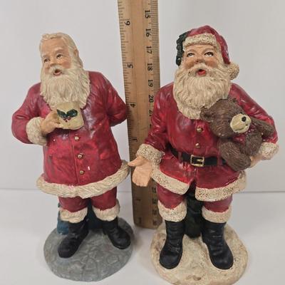 LOT 92: Two Lighted Santa Claus Christmas Window Decor, Two Miniature Noel Candle Trains, and Jolly St Nick Collection Two Jovial Holiday...