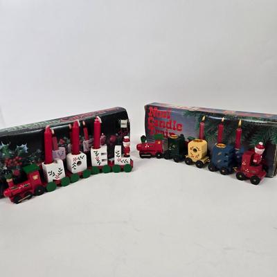 LOT 92: Two Lighted Santa Claus Christmas Window Decor, Two Miniature Noel Candle Trains, and Jolly St Nick Collection Two Jovial Holiday...