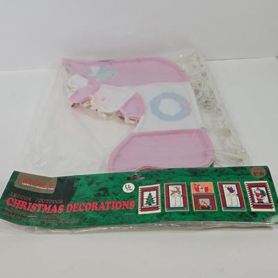 LOT 92: Two Lighted Santa Claus Christmas Window Decor, Two Miniature Noel Candle Trains, and Jolly St Nick Collection Two Jovial Holiday...