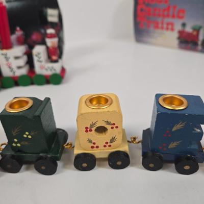 LOT 92: Two Lighted Santa Claus Christmas Window Decor, Two Miniature Noel Candle Trains, and Jolly St Nick Collection Two Jovial Holiday...