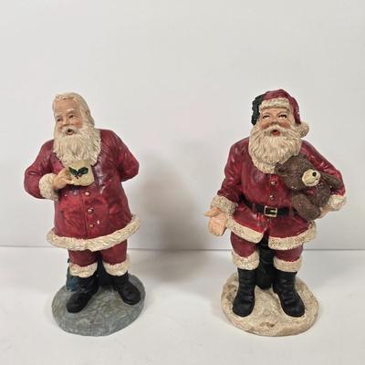LOT 92: Two Lighted Santa Claus Christmas Window Decor, Two Miniature Noel Candle Trains, and Jolly St Nick Collection Two Jovial Holiday...