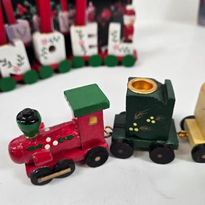 LOT 92: Two Lighted Santa Claus Christmas Window Decor, Two Miniature Noel Candle Trains, and Jolly St Nick Collection Two Jovial Holiday...