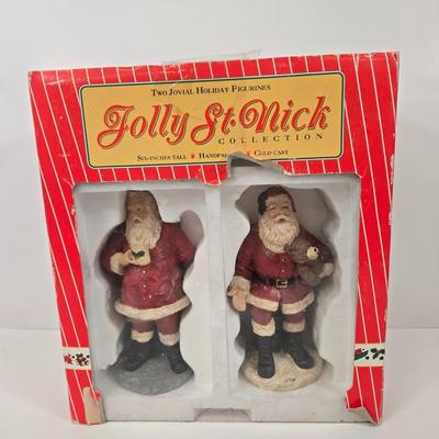 LOT 92: Two Lighted Santa Claus Christmas Window Decor, Two Miniature Noel Candle Trains, and Jolly St Nick Collection Two Jovial Holiday...