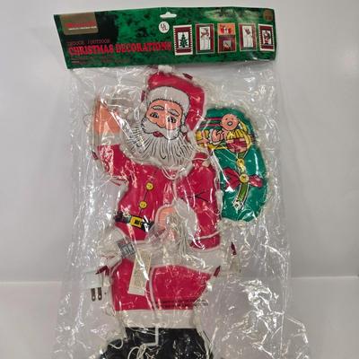 LOT 92: Two Lighted Santa Claus Christmas Window Decor, Two Miniature Noel Candle Trains, and Jolly St Nick Collection Two Jovial Holiday...