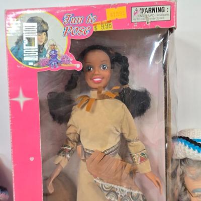 LOT 93: Vintage Country Western Dolls with Crocheted Outfits, Furskins, and More