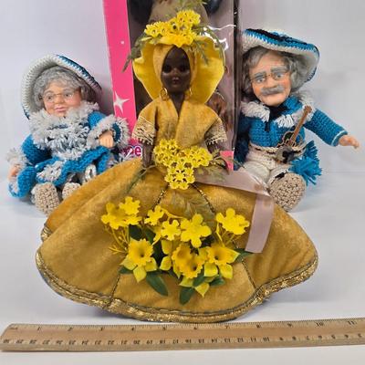 LOT 93: Vintage Country Western Dolls with Crocheted Outfits, Furskins, and More