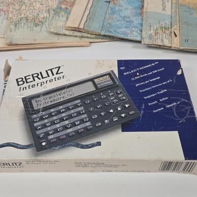 LOT 95: Travel Lot Including Vintage Maps, Brochures, Berlitz Interpreter, Postcards, Stamps, and More