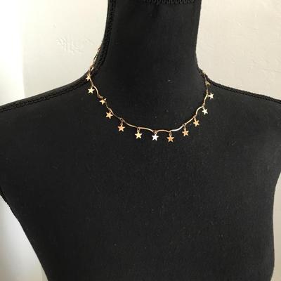 Cute gold tone, star necklace