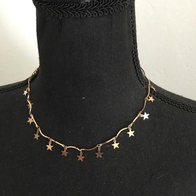 Cute gold tone, star necklace