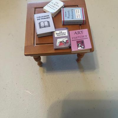 Doll table with books
