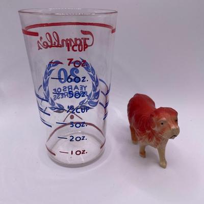 Gamble’s measure cup with plastic dog