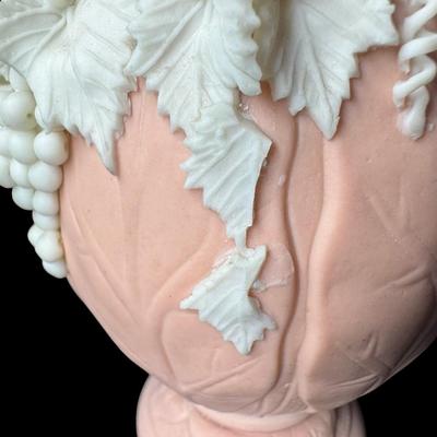 Sale Photo Thumbnail #461: Jasperware is a fine, unglazed stoneware known for its matte finish and high relief white accents. This piece is possibly Victorian, made by Bennington. There is one small chip on the crown, and some leaves are broken. Measurement: 7.5”H x 3.5”W. [BK]