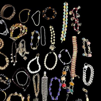 Sale Photo Thumbnail #469: Includes gold tone, silver tone, beads, stones, faux pearls, and more. Styles include cuff, bangle, chain, and others. Total of 40+ pieces. [BK]