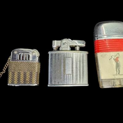 Sale Photo Thumbnail #483: Includes lighters, a tin litho noisemaker, watches, miniatures, and more. Total of 30+ pieces. Watches and lighters not tested. [BK]