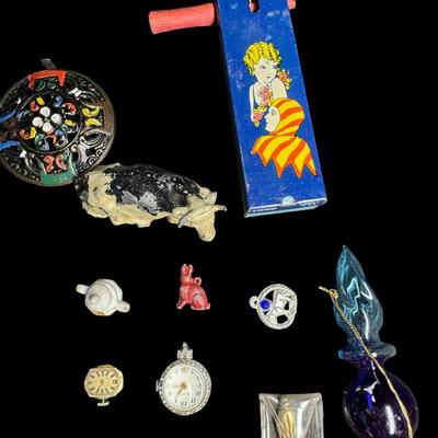 Sale Photo Thumbnail #485: Includes lighters, a tin litho noisemaker, watches, miniatures, and more. Total of 30+ pieces. Watches and lighters not tested. [BK]