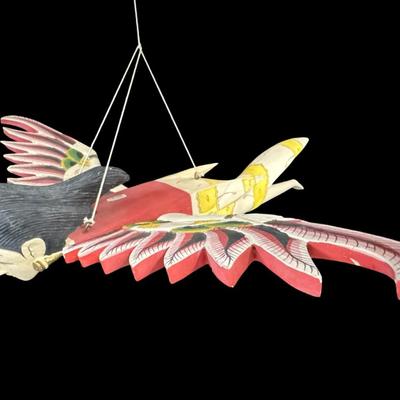 Sale Photo Thumbnail #490: Garuda is a mythical divine bird in Hindu mythology. This has wood construction, with removable wings. Measurement: 18”L x 20.5”W. Pre-auction estimate: $25-$50. [BK]