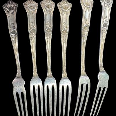 Sale Photo Thumbnail #504: [61g] Includes six late Victorian oyster forks. These have intricate flowing lines with a floral motif. [TM]
