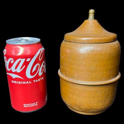 Sale Photo Thumbnail #507: This tea caddy is constructed of hand hammered copper, and has a beautiful patina. There are no dents. Measurement: 7”H x 4.25”W. Pre-auction estimate: $25-$50. [BK]