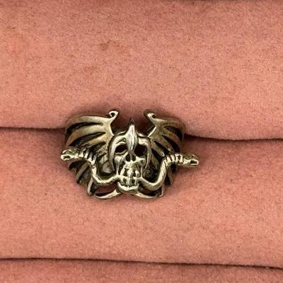 Sale Photo Thumbnail #520: Includes five silver tone rings. Three are adjustable. [BK]