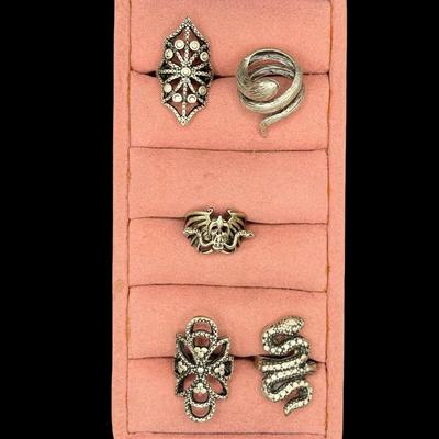 Sale Photo Thumbnail #518: Includes five silver tone rings. Three are adjustable. [BK]