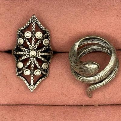 Sale Photo Thumbnail #519: Includes five silver tone rings. Three are adjustable. [BK]