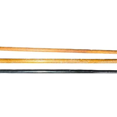 Sale Photo Thumbnail #521: Includes three vintage canes. All three have stag pommels. Two have highly polished pommels, and one is raw antler. They are most likely made of ash wood. Measurement of longest: 39”. [PT]