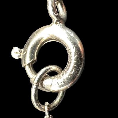 Sale Photo Thumbnail #528: [1.87g] The pendant is a cross with a clear stone, and is marked “Sterling, Chapel.” The cable chain is marked “sterling,” and measures 15 inches long. [BK]