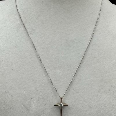 Sale Photo Thumbnail #527: [1.87g] The pendant is a cross with a clear stone, and is marked “Sterling, Chapel.” The cable chain is marked “sterling,” and measures 15 inches long. [BK]