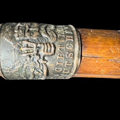 Sale Photo Thumbnail #540: Includes two canes. One is a European piece with destination badges throughout. The other is believed to be hand carved. Some badges are loose on the European cane. Measurement of longest: 36.5”L. [PT]