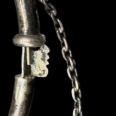 Sale Photo Thumbnail #548: [6.45g] The hinge and closure both work as they should, and the safety chain is intact. Measurement: 2.25”W. Silver content confirmed using Niton XRF precious metals analyzer. [BK]