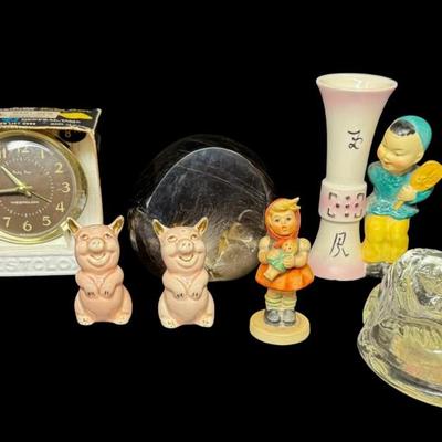 Sale Photo Thumbnail #560: Includes an NOS Baby Ben Westclox alarm clock, a Hummel, pig salt and pepper shakers, a crystal Virgin Mary, a paperweight, and more. Total of eight pieces. The paperweight is chipped (pictured). Measurement of tallest: 5”. [BK]