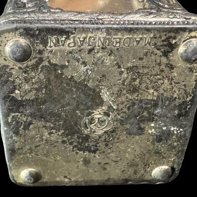 Sale Photo Thumbnail #565: Includes three perfumes, a silver tone trinket box with pink glass insert, and an enamelware Toleware metal trinket box. There is age related wear and minimal paint loss to the Toleware piece. The two pink perfume bottles have damaged stoppers. [BK]