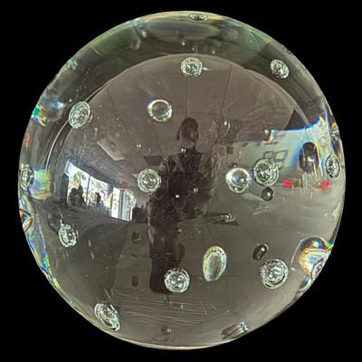 Sale Photo Thumbnail #577: This piece features controlled bubbles inside of blown glass. It is illegibly signed on the base. Measurement: 5.5” Diameter.  [BK]
