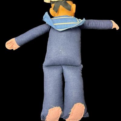 Sale Photo Thumbnail #580: This has a cloth body with a composite head. It is possibly made by Norah Wellings. It was a souvenir or memento of a cruise. There is some age related wear. Measurement: 10”H. [BK]