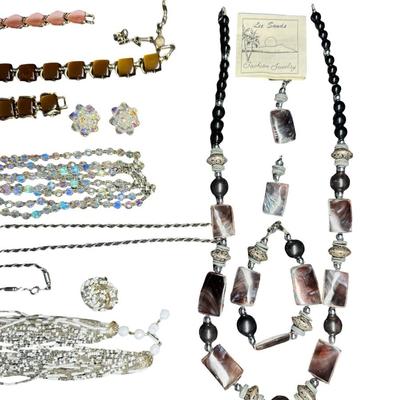Sale Photo Thumbnail #594: Includes gold tone, silver tone, rhinestones, beads, crystals, and more. These ensembles include a combination of necklaces, bracelets, and/or earrings. Total of eight sets. [BK]